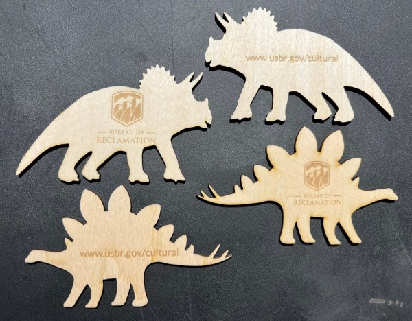 Laser cut and engraved dinosaur cutouts